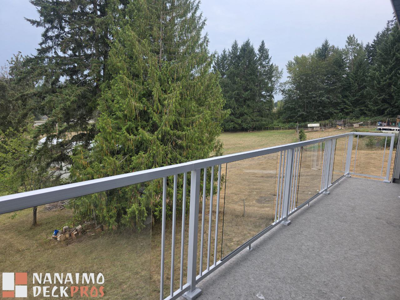 Modern Elevated Composite Deck with Glass Railings in Nanaimo